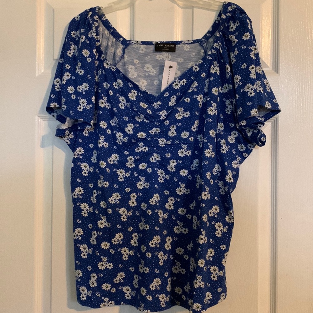 FabuPlus Lane Bryant royal blue t-shirt with  small daisies and ruched v-neck.
